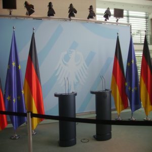 The lack of laws and regulations In Cyber space till recently, made it difficult for government's to regulate their usage (and empty conference area in the federal chancellery of Berlin to demonstrate the missing of laws).